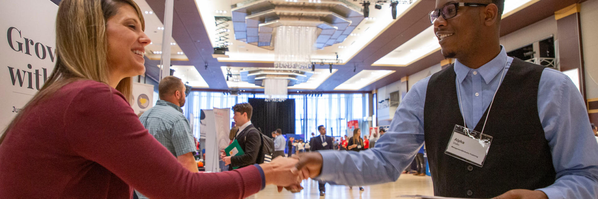 People shaking hands at a career fair